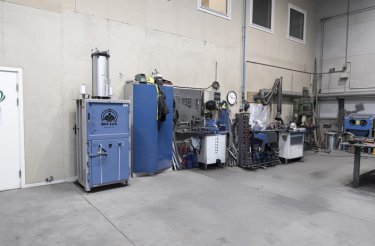 baler against wall in raw environment