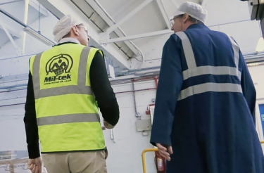 Two men in hi-vis vests