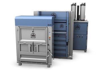 electric baler in front of two other balers