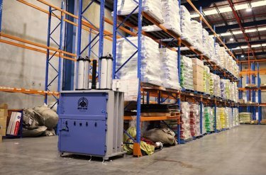 pneumatic baler at end of aisle