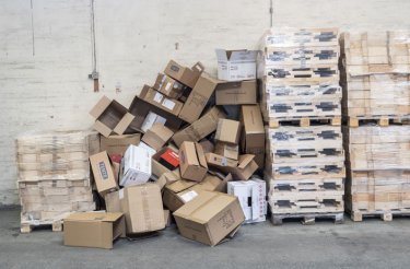 cardboard boxes in pile on floor